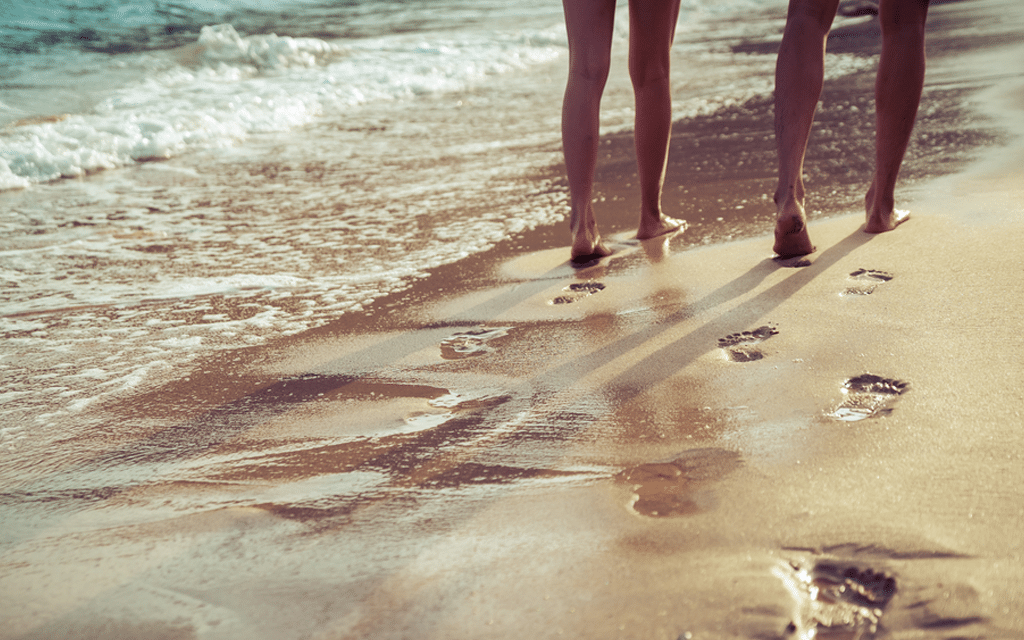 Couple walking on beach symbolizing the journey of integrated treatment options for addressing both mental health and substance abuse