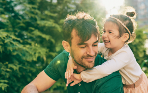 a father in recovery enjoys quality time with his young daughter