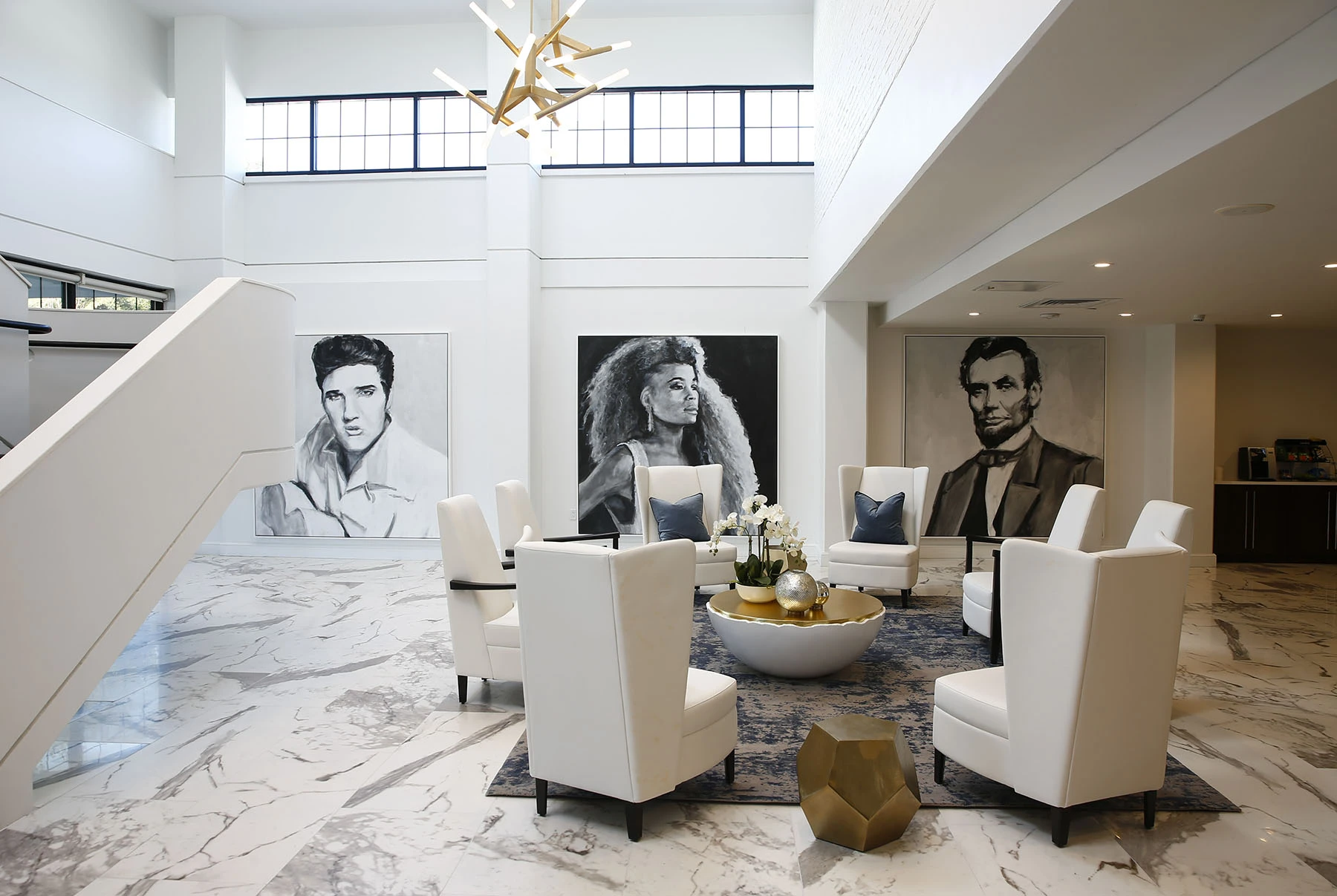 Modern lounge with large portraits