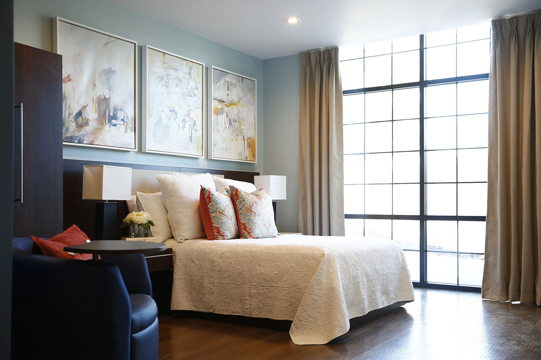 Cozy bedroom with large windows