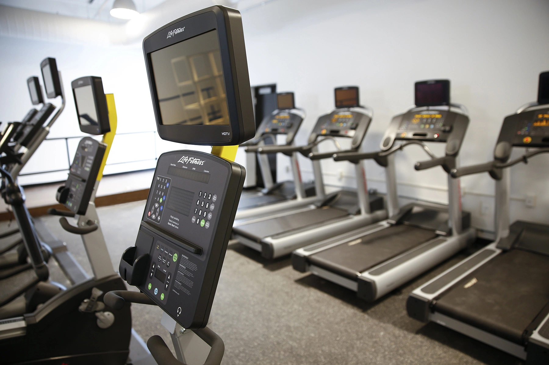 empty gym with exercise equipment