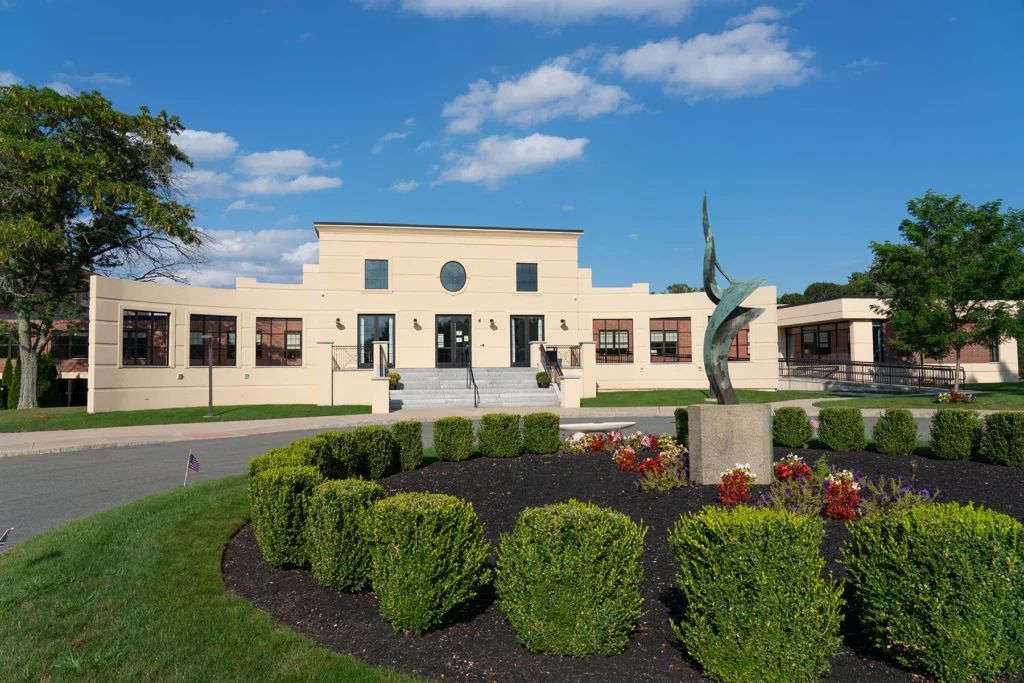 Modern building with sculpture and landscaping
