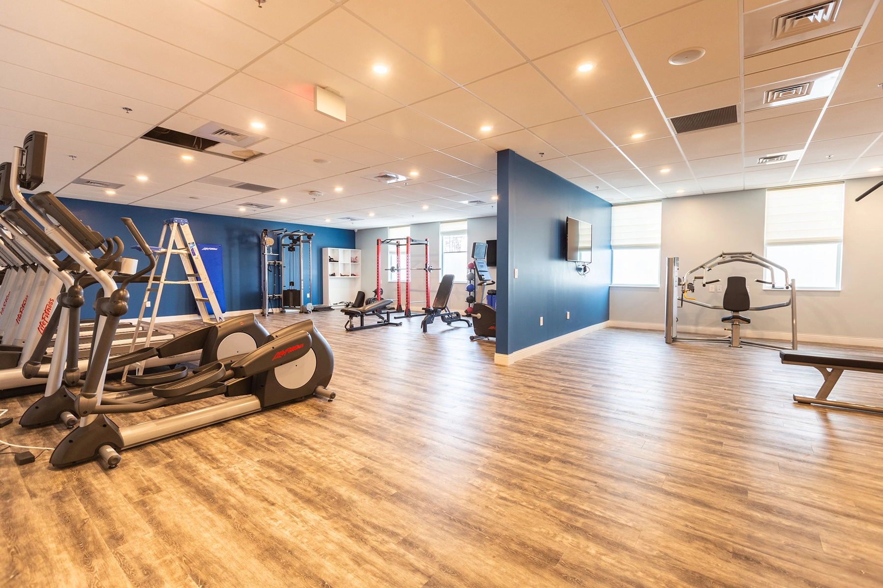 Gym at Lighthouse with cardio machines and strength training equipment