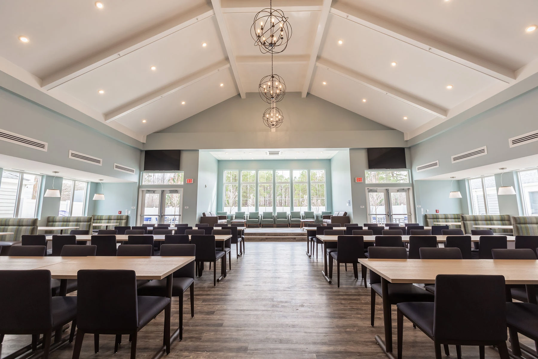 Spacious dining room at Lighthouse with rows of tables and chairs