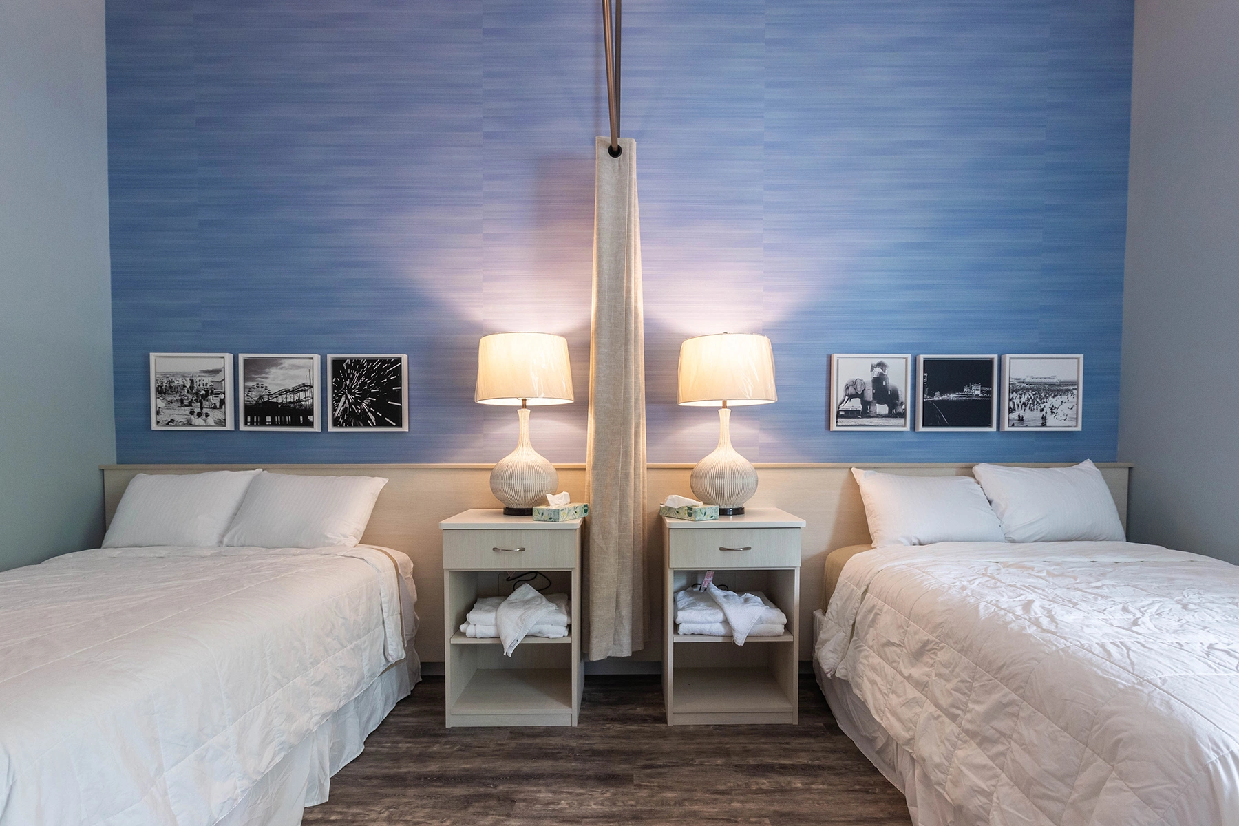 Shared patient room at Lighthouse with two beds, lamps and framed photos