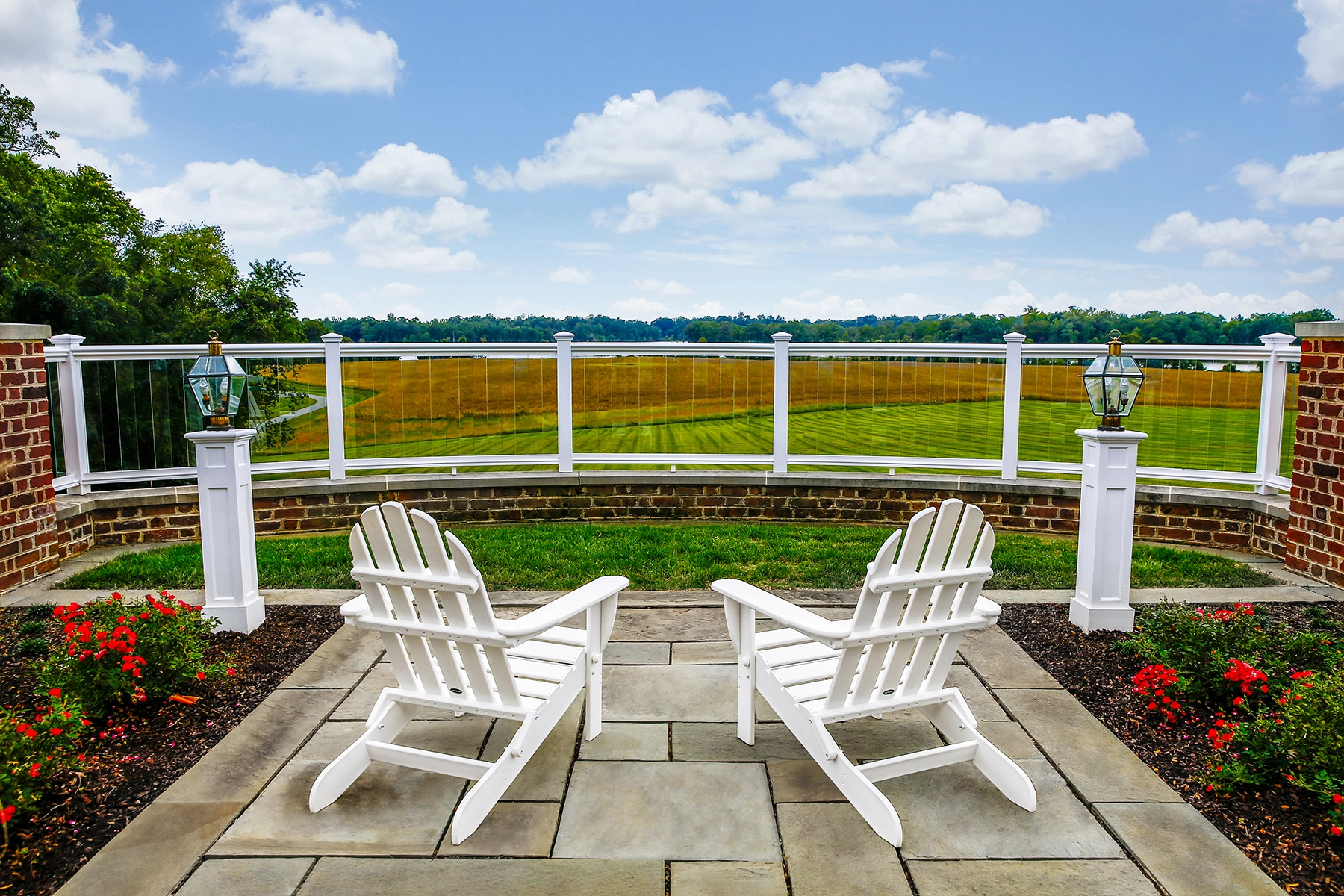 Chairs overlooking a scenic landscape.